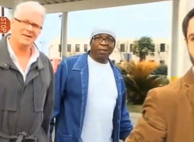 Glenn Ford, 64, (with white cap) walks out of prison on Tuesday.