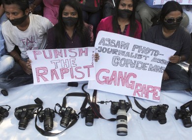 Photojournalists during a protest over the gang rape of the 22-year-old in Mumbai