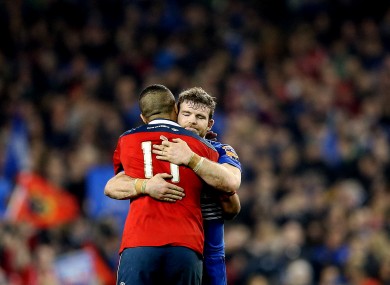 Munster's Simon Zebo embraces Gordon D'Arcy at the final whistle.