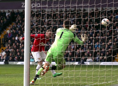 Manchester United's Wayne Rooney (left) scores his team's second goal.