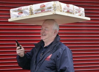 We don't know if Richard McKeon, who has worked for Johnston Mooney & O'Brien bakery since 1975, uses textspeak but we do admire his balancing act while delivering bread on Dublin's Baggot Street.