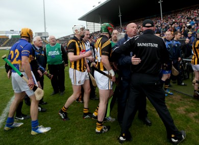 Brian Cody is restrained as the teams leave the field.