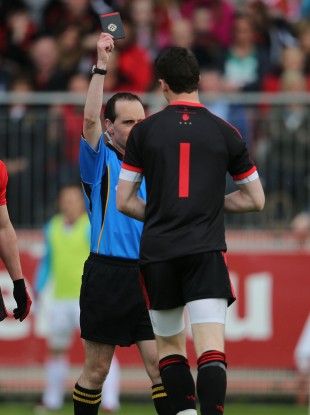 David Coldrick brandishes a black card to Niall Morgan on Sunday.