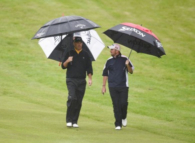 Ireland's Shane Lowry (right) with Denmark's Thomas Bjorn on the fairway during day three of the BMW PGA Championships at the Wentworth Club,