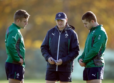 Out-halves Ian Madigan (left) and Paddy Jackson speak with Ireland coach Joe Schmidt.