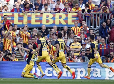 Atletico teammates celebrate after scoring.