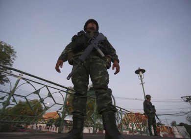Thai soldiers guard in front of Marble Temple after soldiers staged a coup today.