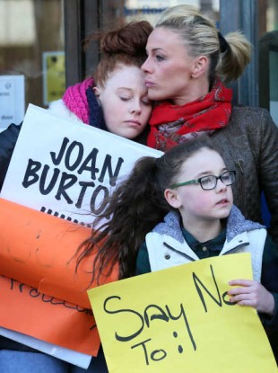 Gwen Connell with two of her three daughters Lauren (left, 17) and Katie (10) protest after being faced with homelessness due to a raising of their rent and a cut in rental allowance.