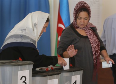 Azeri women cast their ballot papers at a polling station in Nardaran, 35km north of Baku, Azerbaijan last October.