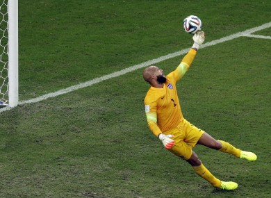 Tim Howard tips Eder's shot over the USA bar.