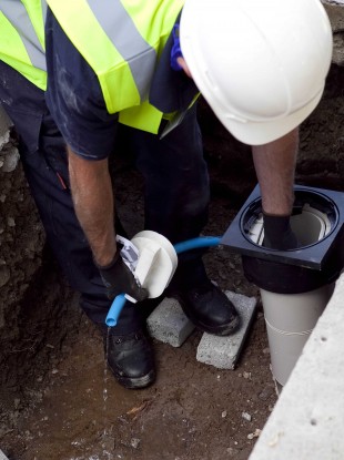 Water metre being installed.