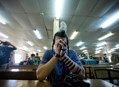 A student participates in a prayer for the two missing teenagers at a synagogue in the Jewish settlement of Kfar Etzion