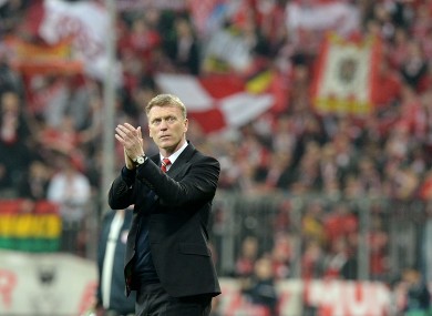David Moyes applauds the Manchester United supporters after the club's Champions League elimination to Bayern Munich.