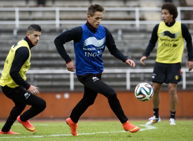 Januzaj training with Belgium's Kevin Miralles (left) and Axel Witsel.