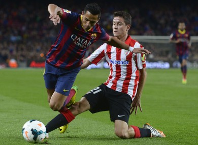 Herrera slides in on Barcelona's Alexis Sanchez.