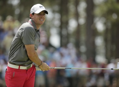 Rory McIlroy watches his tee shot on the 13th hole.