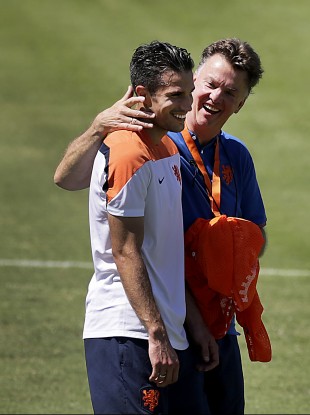 Football friends: Coach Louis van Gaal, right, shares a light moment with Robin van Persie.