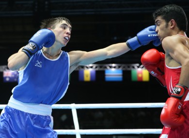Northern Ireland's Michael Conlan, left, lands a left jab on India's Shiva Thapa.