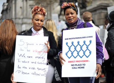 Bijoux Nseya (left) and Natalie Mundeke protest outside Leinster House this afternoon calling for an end Direct Provision.