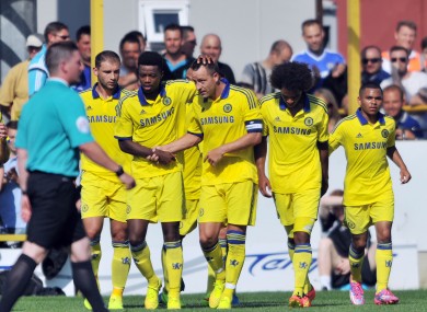 Chelsea XI's John Terry celebrates scoring with team-mates.
