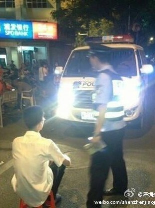 The image released by Shenzhen police, apparently showing somebody being forced to stare into high-beams.
