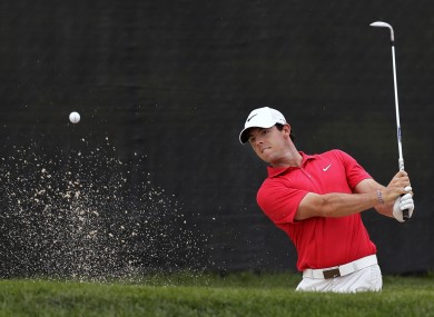 Rory McIlroy, of Northern Ireland, hits from a bunker on the 13th hole during the first round of play at The Barclays golf tournament.