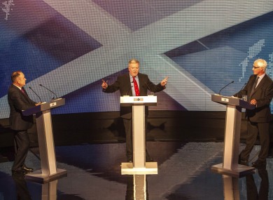 Alex Salmond (l), Alistair Darling (r) and moderator Bernard Ponsonby (c) during the debate tonight.