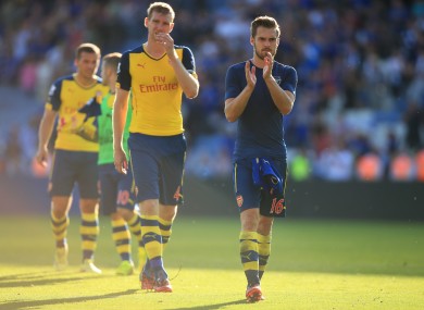 Arsenal's Aaron Ramsey (right) and Arsenal's Per Mertesacker (left) dejected after the Barclays Premier League match at the King Power Stadium.