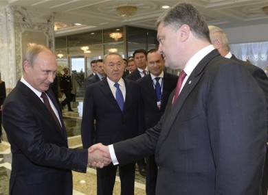 Russian President Vladimir Putin shakes hands with his Ukrainian counterpart Petro Poroshenko before talks in Minsk.