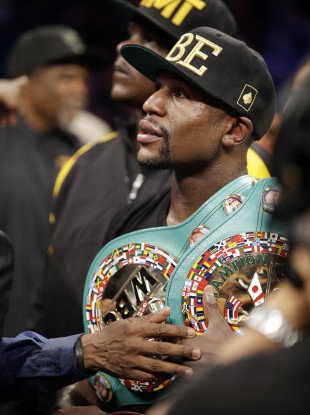 Mayweather retained his welterweight and light-middleweight titles with the 47th straight win of his unbeaten career.