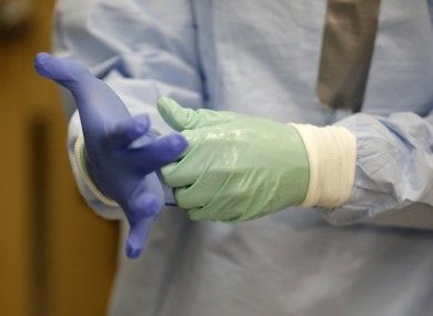 A nurse demonstrates Ebola protection gear.