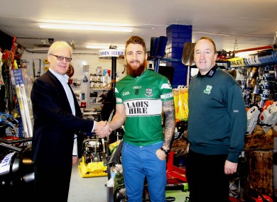 Michael Killeen, M.D. Laois Hire, with Portlaoise’s Zach Tuohy and Club Officer, John Hanniffy.