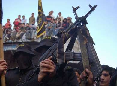 FILE: Armed members of the Islamic Jihad movement during a demonstration Nablus, in support of their leader Ramadan Shallah in Syria,