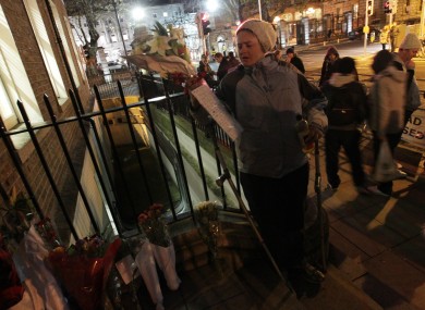 Flowers in the doorway where Jonathan Corrie died earlier this month.
