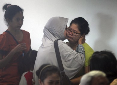Relatives wait for news at Juanda International Airport