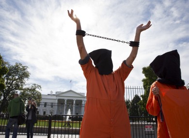 People protesting against indefinite detentions at Guantanamo Bay.
