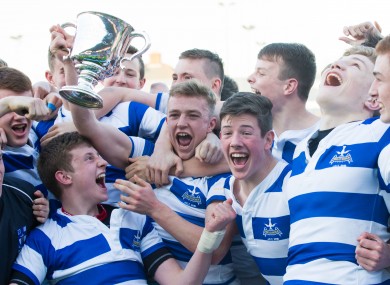 Blackrock captain Liam Turner lifts the Junior Cup.