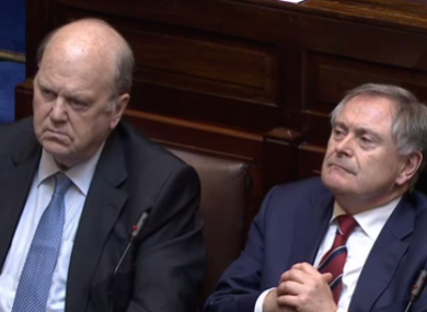 Michael Noonan and Brendan Howlin listening to considerable criticism of their speeches earlier