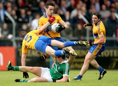 Clare’s Shane Brennan and Shane Hickey with John Riordan of Limerick.