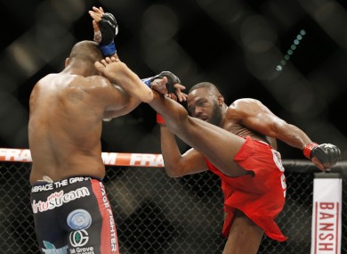 Jones kicks Daniel Cormier during their light heavyweight title bout at UFC 182 in January.
