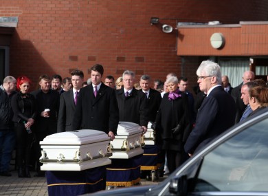 The remains of the three Connors children are taken from the church.