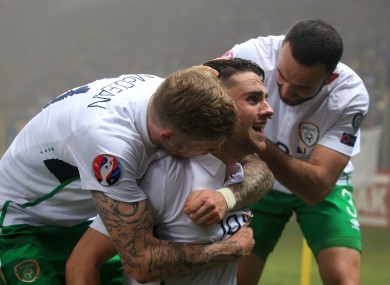 Robbie Brady celebrates with teammates after scoring.