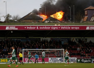 The game continues despite the blaze.