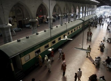 File photo: Passengers board a train at the Lahore railway station in Pakistan.