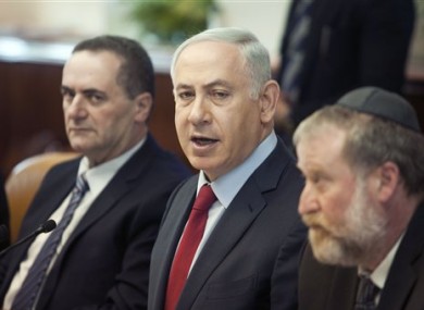 Israeli Prime Minister Benjamin Netanyahu, centre, attends a weekly cabinet meeting in Jerusalem yesterday.