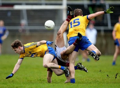 Roscommon's Cian Connolly and Cathal McHugh collide with Galway's Eoghan Kerin.