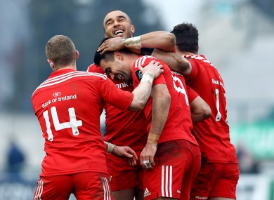 Conor Murray celebrates his try with his team-mates.