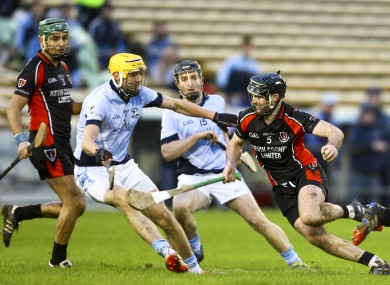 Na Piarsaigh's David Breen tries to stop Oulart-the-Ballagh's Eoin Moore.