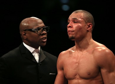 Chris Eubank Snr (left) speaks to his son Chris Eubank Jnr (file photo).