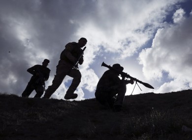 Shiite fighters clash with the Islamic State group at the frontline in Tikrit last month.